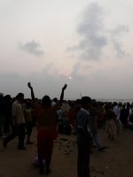 Pilgrims at the 2004 Chandrabhaga Festival, held at the seashore of Konarka, India, taking holy bath and saluting Sun God Surya at sunrise.