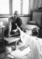 Interviewing Thai Buddhist monk Phra Chamroon Parnchand, head of Wat Tham Krabok monastery and drug addiction treatment center, Sarabari, Thailand, 1987.